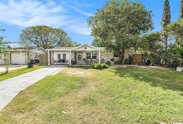 single story home with a front lawn