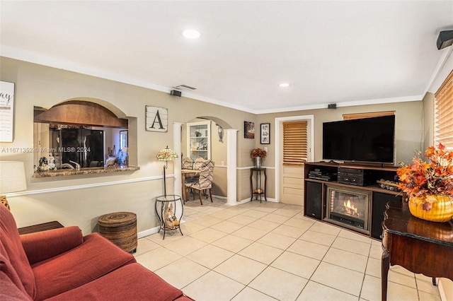 tiled living room featuring crown molding