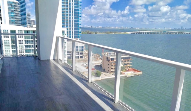 balcony featuring a water view