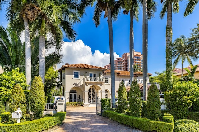 mediterranean / spanish-style home featuring a balcony