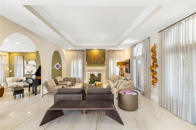 living room featuring crown molding and a tray ceiling