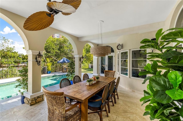 view of patio featuring ceiling fan