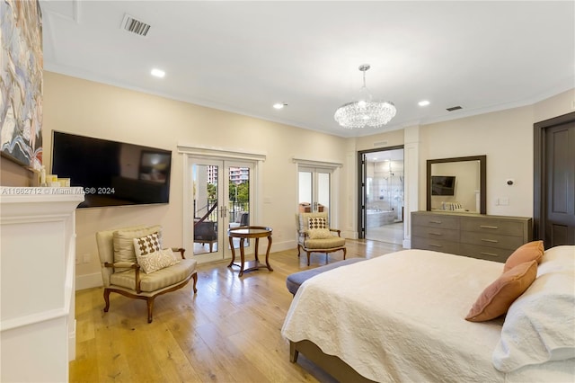 bedroom featuring access to exterior, french doors, light hardwood / wood-style flooring, a notable chandelier, and crown molding