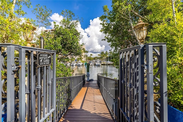 view of gate featuring a water view