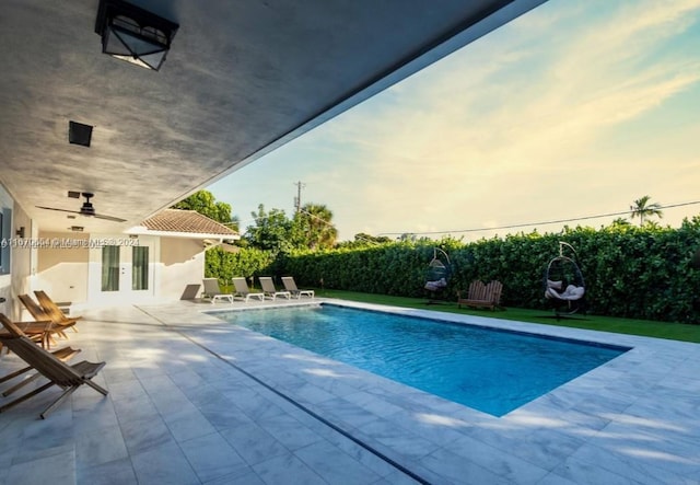 view of pool featuring french doors and a patio