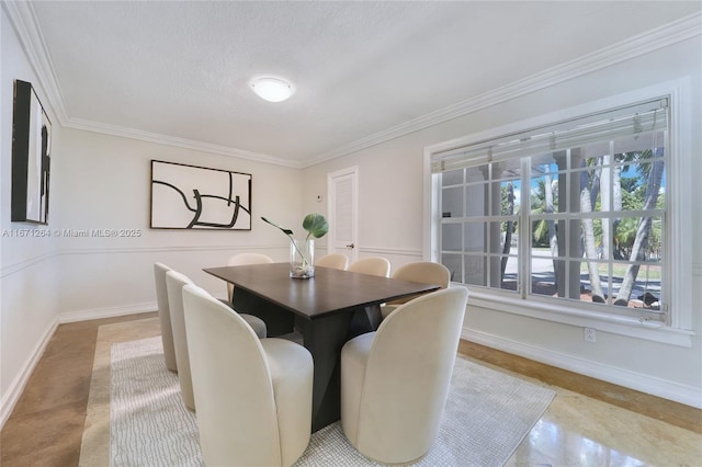 dining room featuring ornamental molding, a textured ceiling, and baseboards