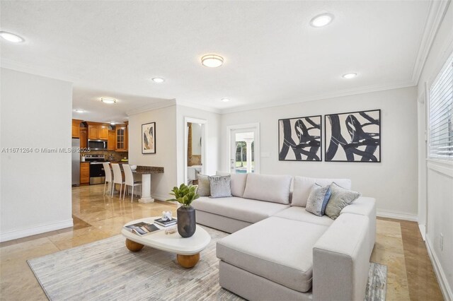 tiled living room featuring crown molding