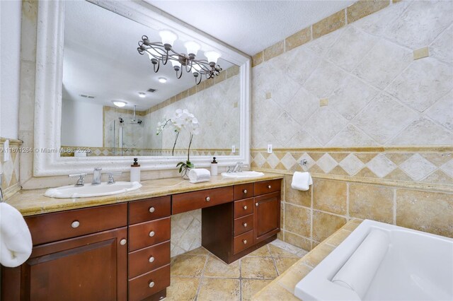 bathroom with tile walls, vanity, and plus walk in shower