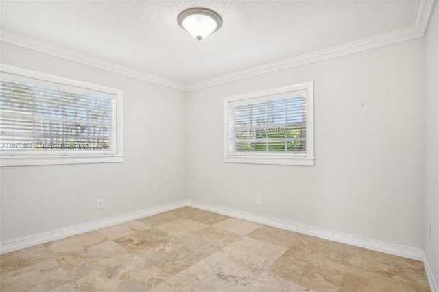 empty room with crown molding, a textured ceiling, and baseboards