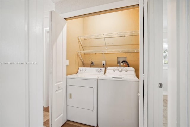 laundry area with laundry area and washer and clothes dryer