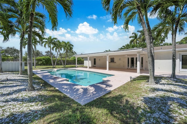 view of swimming pool with a patio area, fence, a fenced in pool, and french doors