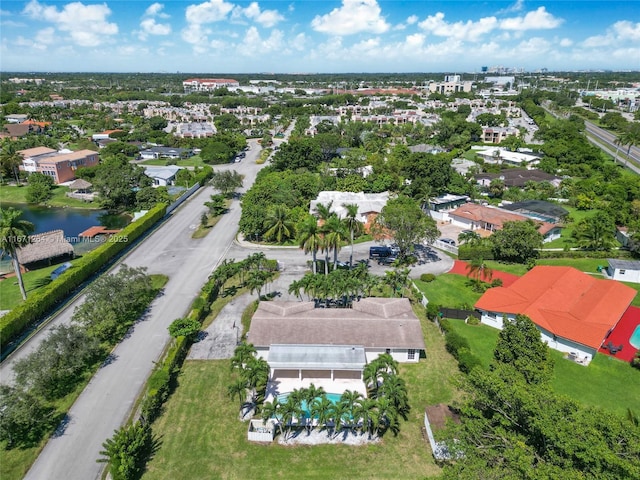 birds eye view of property with a water view and a residential view