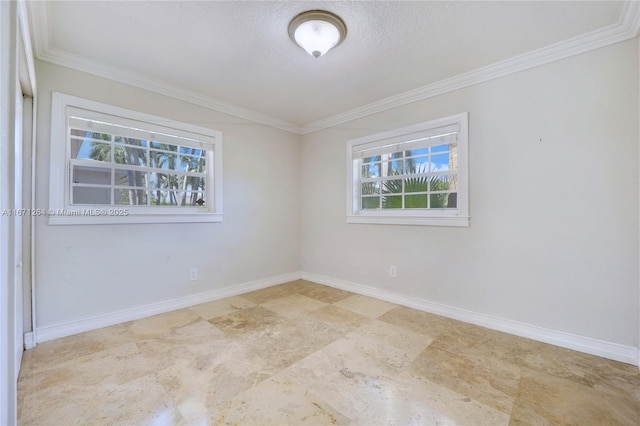 unfurnished room featuring a textured ceiling, ornamental molding, and baseboards