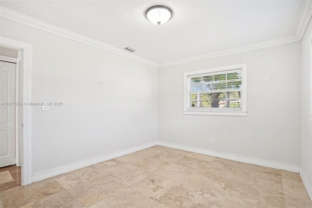 unfurnished room featuring crown molding and a textured ceiling