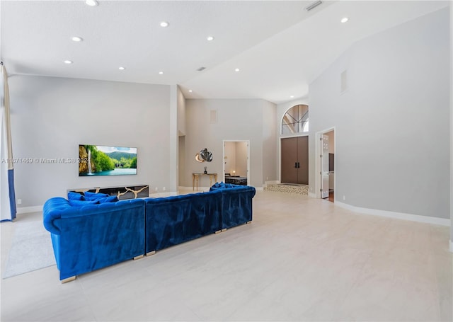 living room with high vaulted ceiling