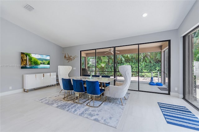 dining space with lofted ceiling