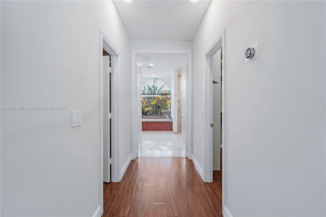 hall with dark hardwood / wood-style floors