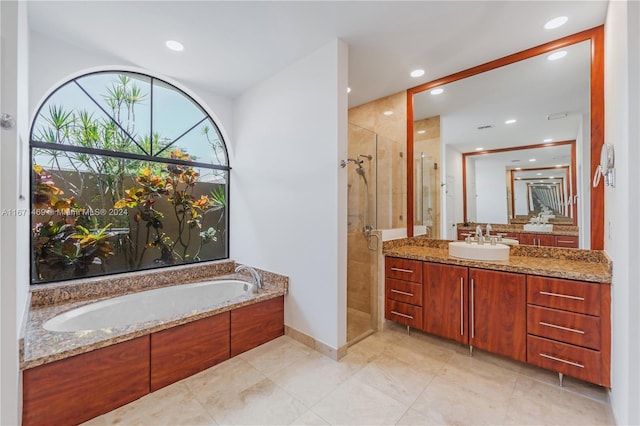 bathroom with plus walk in shower and vanity