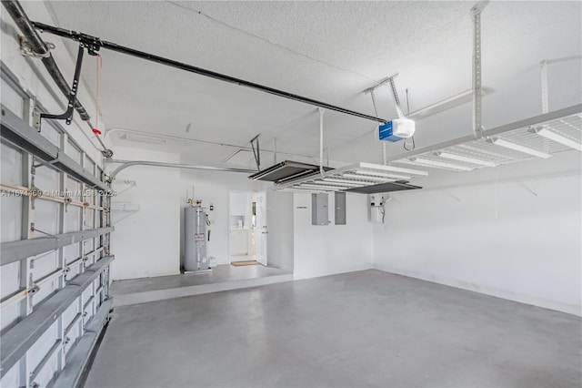 garage featuring a garage door opener, electric panel, and electric water heater