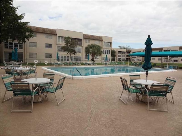 view of swimming pool featuring a patio area