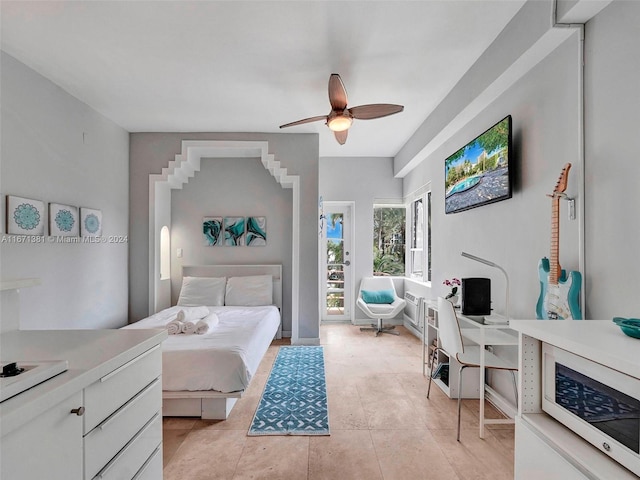 bedroom featuring ceiling fan and light tile patterned floors