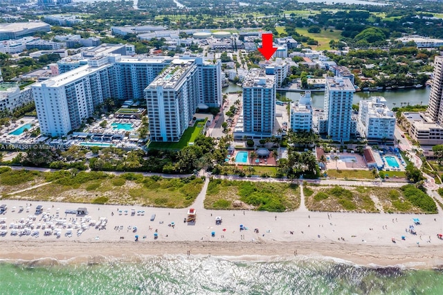 aerial view featuring a water view and a view of the beach