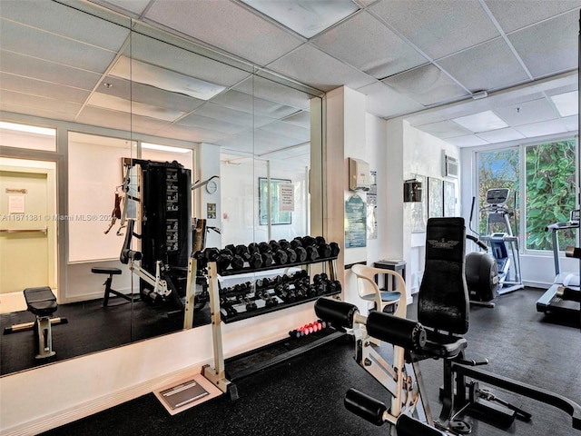 gym featuring a drop ceiling