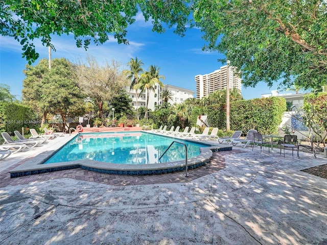 view of swimming pool featuring a patio