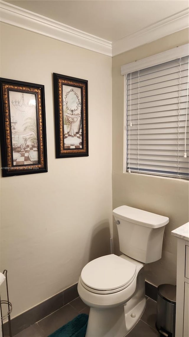 bathroom with ornamental molding, tile patterned floors, vanity, and toilet