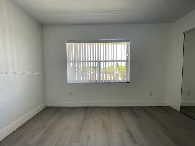 spare room featuring light hardwood / wood-style flooring