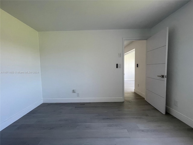 unfurnished room with hardwood / wood-style floors