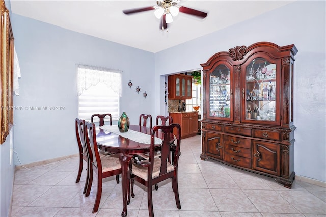 tiled dining area featuring ceiling fan