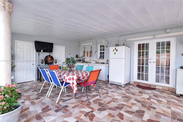 dining space with french doors and ornate columns