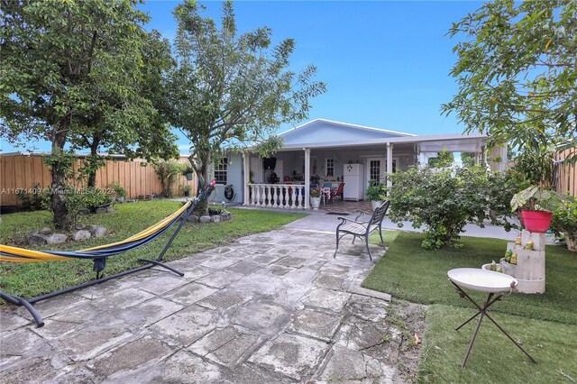 rear view of house featuring a lawn