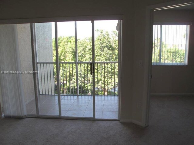 9511 Weldon Cir Unit G402, Tamarac, FL 33321 - spare room featuring carpet floors and baseboards