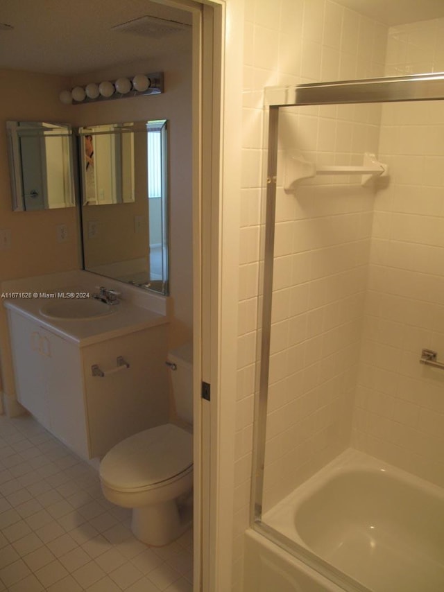 full bathroom featuring shower / bathing tub combination, tile patterned flooring, vanity, and toilet