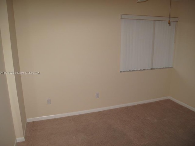 9511 Weldon Cir Unit G402, Tamarac, FL 33321 - unfurnished room with carpet and baseboards