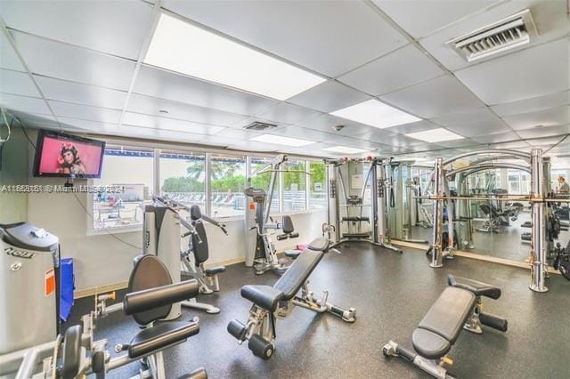 exercise room with a drop ceiling