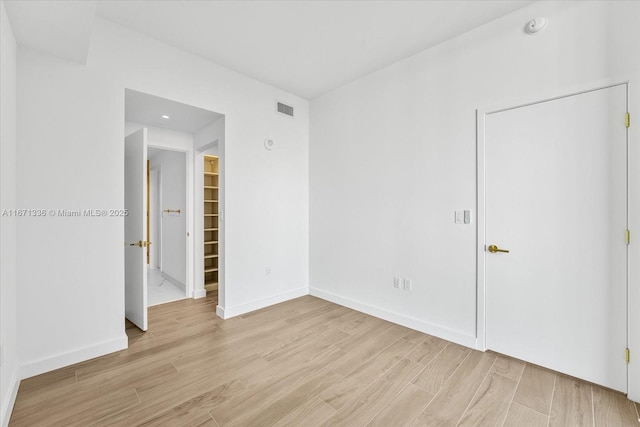 empty room with light wood-type flooring