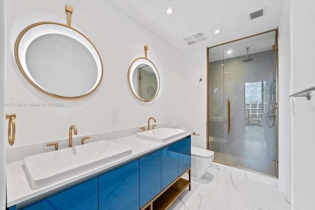 bathroom with walk in shower, vanity, and toilet