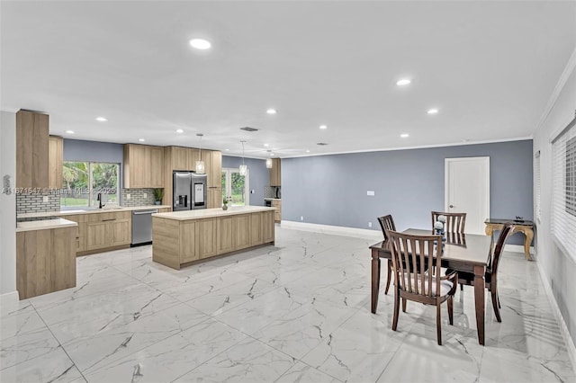 11811 NW 5th Ct, Plantation, FL 33325 - kitchen with stainless steel appliances, recessed lighting, a kitchen island, baseboards, and light marble finish floors