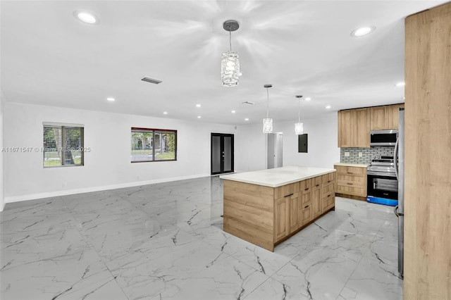 kitchen with stainless steel appliances, electric panel, tasteful backsplash, a kitchen island, and decorative light fixtures