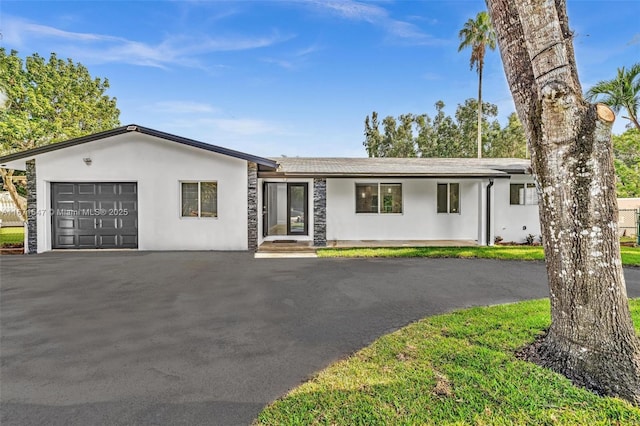 single story home with a garage