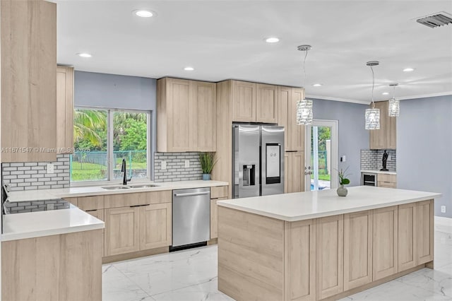 11811 NW 5th Ct, Plantation, FL 33325 - kitchen with light brown cabinets, stainless steel appliances, light marble finish floors, a sink, and recessed lighting