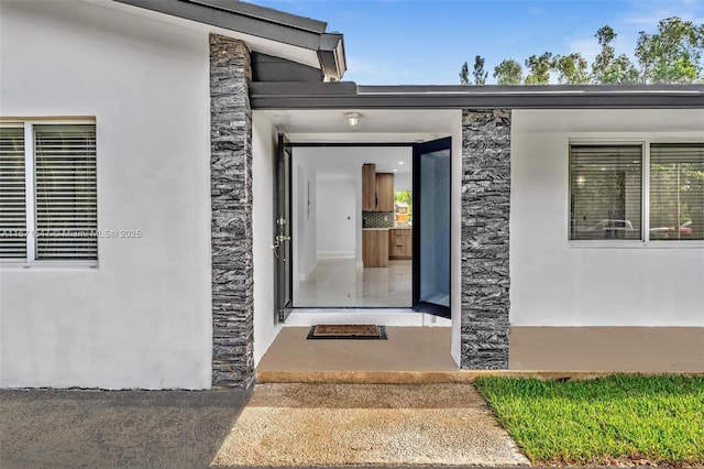 11811 NW 5th Ct, Plantation, FL 33325 - property entrance featuring stone siding and stucco siding