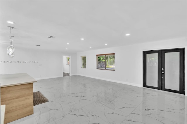 11811 NW 5th Ct, Plantation, FL 33325 - unfurnished living room with marble tiled floors, recessed lighting, baseboards, and french doors