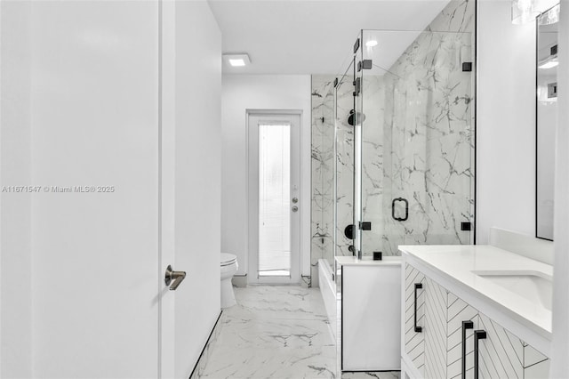 bathroom featuring vanity, an enclosed shower, and toilet