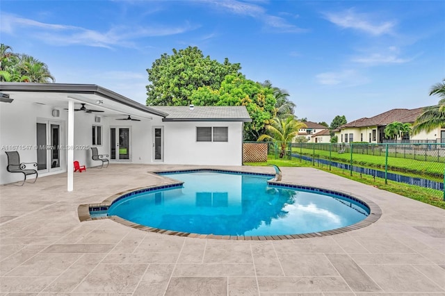 view of pool with a patio area and ceiling fan