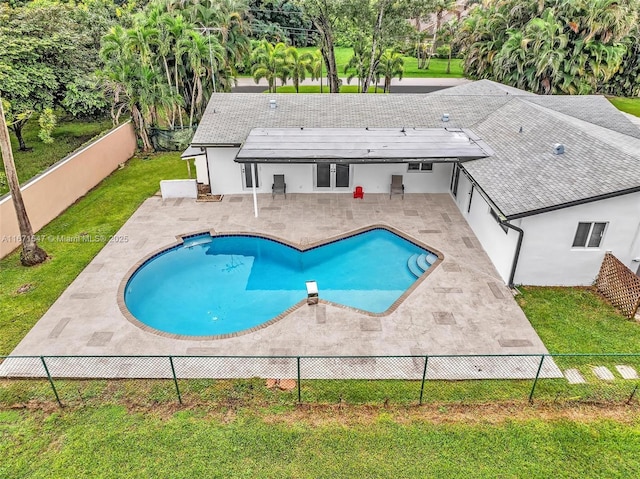 view of swimming pool with a lawn and a patio area