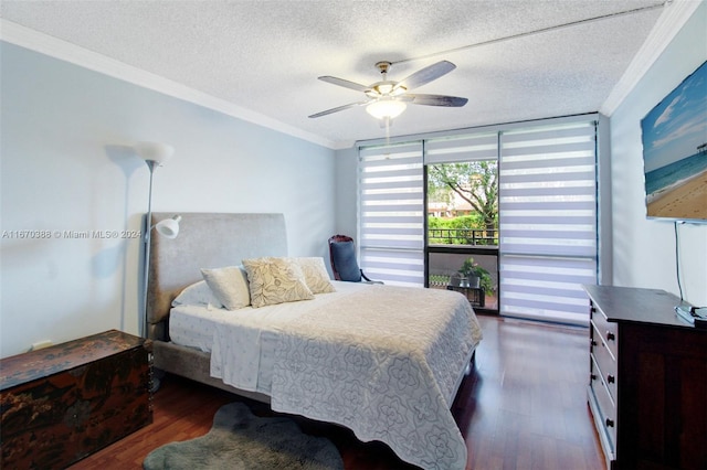 bedroom featuring a textured ceiling, ornamental molding, dark hardwood / wood-style flooring, and ceiling fan